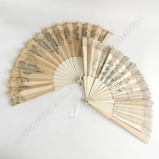 two antique fans, both pale beige silk and casein…